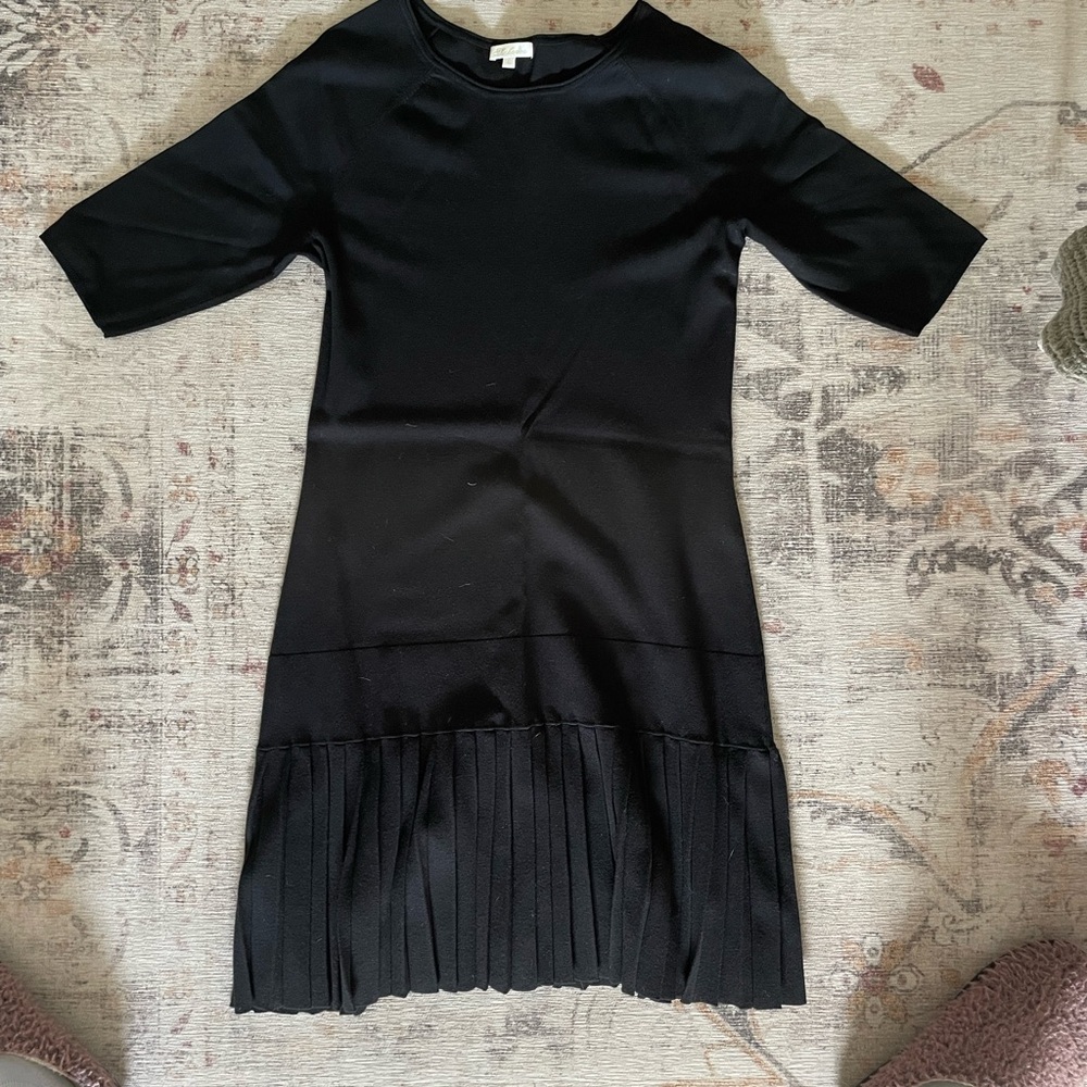 Elegant Black Dress with Pleated Hem